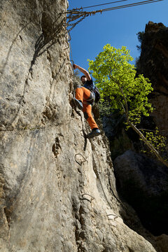 Climbing a ferrata route in Bierge in Guara Mountains.