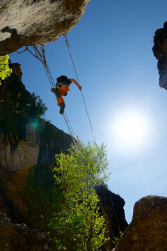 Crossing a suspension bridge in Bierge in Guara Mountains.