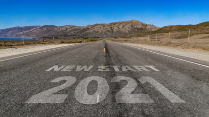 New Start 2021 written on highway road to the mountain