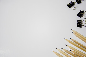 calculator pencils magnifier lie on a white background. concept of education, business. place to write