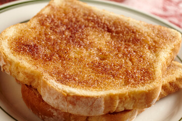 Two slices of cinnamon toast on a plate