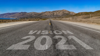 Vision 2021 written on highway road to the mountain