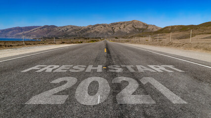 Fresh Start 2021 written on highway road to the mountain