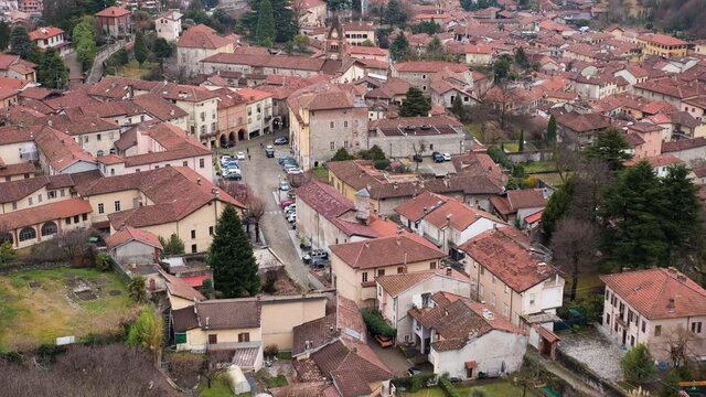 Avigliana, Italy. 2021 7th, 2021. Timelapse video. Top view of the medieval historic center of Avigliana in the province of Turin at late afternoon.