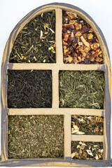 six types of tea portioned. Black, green, white and fruit tea.