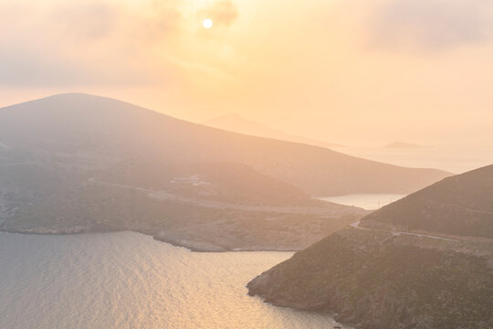 Hazy morning view of Fourni coastline and Agios Minas island.