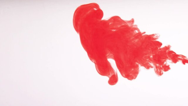 red Color paint drops in water , drop of red Ink color falling on water Colorful ink in water, 4K footage,. High quality FullHD footage