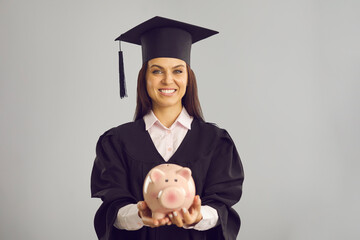 Student saving money to pay for postgraduate college or university education abroad. Happy woman in...