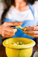 Woman cutting an avocado to make guacamole
