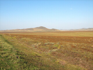 Fototapeta premium autumn steppes and hills of Khakasia, stormy sky