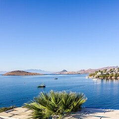 Fototapeta premium Aegean coast with marvelous blue water, rich nature, islands, mountains and small white houses