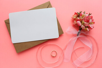 springtime. mockup of a spring postcard. blooming branch of pink sakura on pink background and space for text 