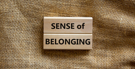 Sense of belonging symbol. Wooden blocks with words 'sense of belonging' on beautiful canvas...