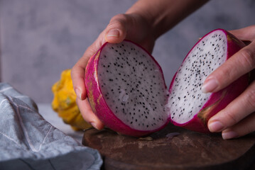 Exotic dragon fruits exposed on gray background