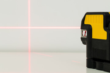 Electronic laser pointing straight lines. Checking angles and setting points while taking measurements