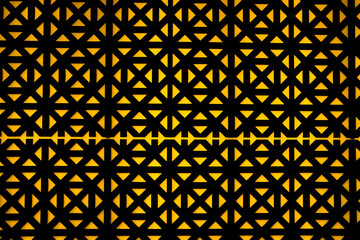 Abstract yellow and black pattern wooden wall texture background. Old wall decoration detail....