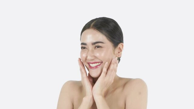 Beauty concept of 4k Resolution. Young Asian woman rejoicing on the white background.