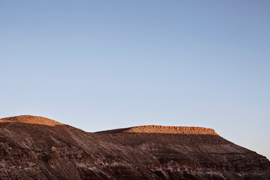 Alpenglow hits the summit of mountains near Telouet, Morocco