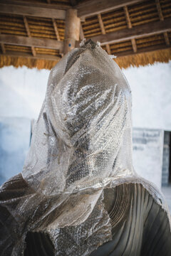 New Buddha Statue with Bubblewrap Around It's Head