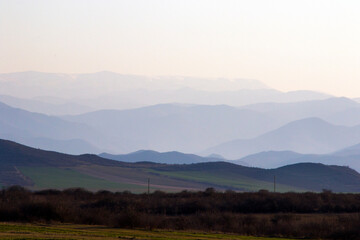 Mountain range landscape during sunset, view of mountain and peak lines, horizon