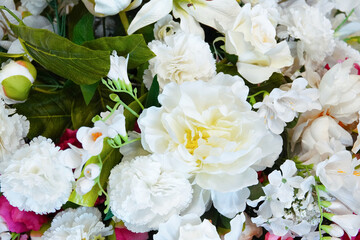 Bouquet white artificial flowers of rose, carnation and peony close-up.