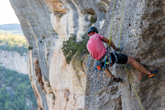 Climber removing the rope in Buoux, France