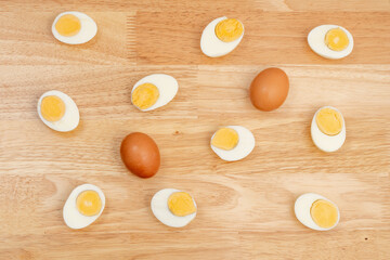 hard-boiled eggs halved on a wooden base