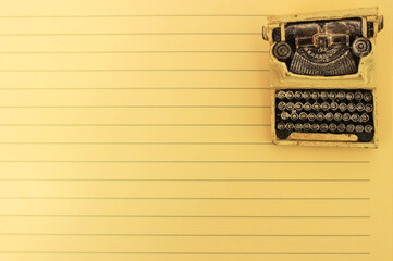 old notebook paper and retro typewriter for writing course background.
