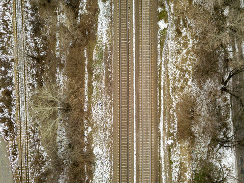 Railroad tracks. Aerial drone view. Winter cloudy morning.