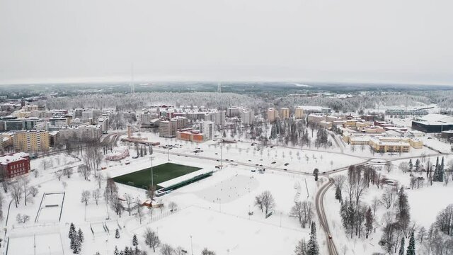 Lahti Finland. Drone video. Static. City view, sports complex. residential buildings and streets in the snow. Day is cloudy