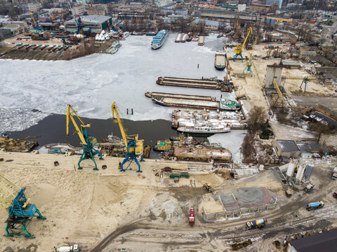 Frozen cargo port bay. Aerial drone view. Winter cloudy morning. - Powered by Adobe