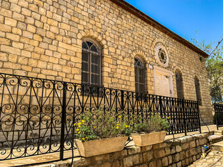 Old synagogue of the 19th century in the picturesque town Rosh Pina, Israel. Entrance to a...