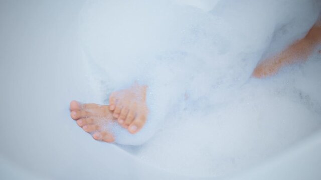 close up  woman legs is bathing in a luxurious bath. Concept of Healthy relaxation