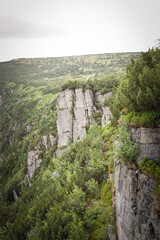 Fototapeta na wymiar Amazing czech nature in our mountain Krkonose. Wonderful highland scenery with huge cliff. Trees are everywhere. Clean air and amazing view.