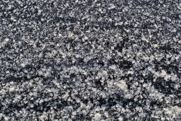 Beautiful close-up view of frost texture on the bench in Ticknock National Forest Park, Co. Dublin. Unusual Irish winter 2021