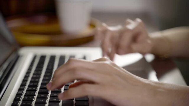 Asian Female hands of business woman professional user worker using typing on laptop notebook keyboard sit at home office desk working online with pc software apps technology concept