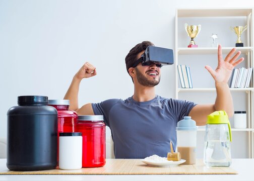 Man with nutrition jars and virtual reality glasses