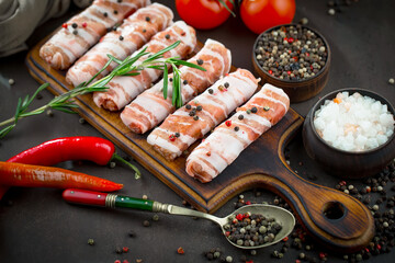 Raw meat with spices in a composition with kitchen accessories.