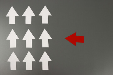 Leadership concept with red arrow leading