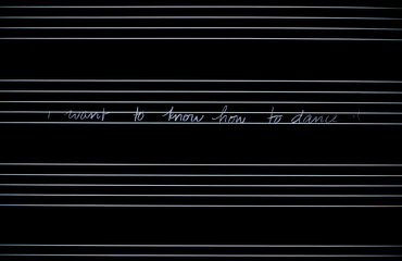 A statement of lyrical content in a musical staff