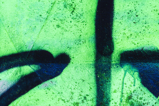 detail of a graffiti painted on a wall