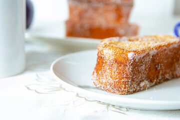 Detail shot of some torrijas, typical Spanish food during Holy Week. Bread dipped in milk and egg, fried in oil.