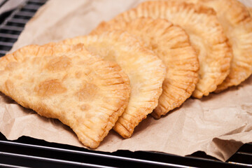 Homemade chebureki, national dish of Tatars, dough with meat and onion.