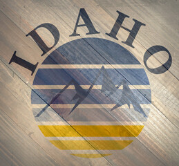 Idaho mountains sign on wood grain texture