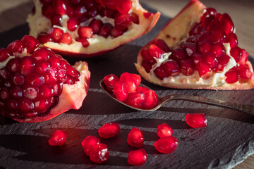 juicy pomegranate. Natural appearance in the kitchen, pieces of fruit healthy and full of vitamins