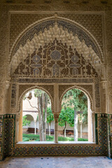 view of detailed and ornate Moorish and Arabic decoration in the arched windows of the Nazaries Palace