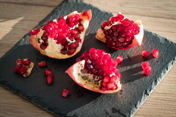 juicy pomegranate. Natural appearance in the kitchen, pieces of fruit healthy and full of vitamins