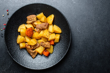 potatoe stewed goulash and meat roast second course vegetables portion on the table healthy meal...