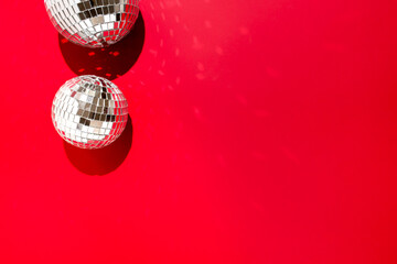 beautiful disco balls on red background.
