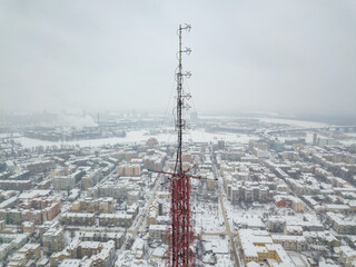 Radio tower over Kiev. Aerial drone view. Winter snowy morning.
